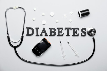 Composition with word DIABETES on light background