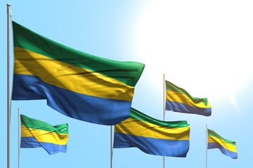 pretty 5 flags of Gabon are wave on blue sky background - any feast flag 3d illustration..