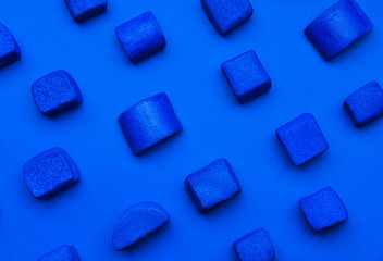 Blue marshmallows on color background