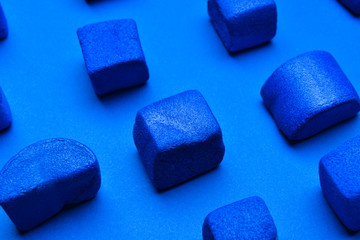 Blue marshmallows on color background