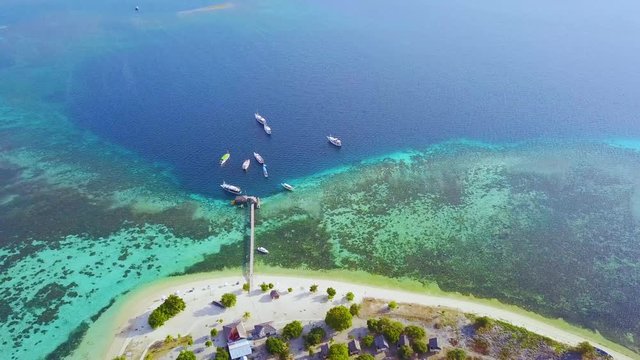 Aerial view of wooden pier at Kanawa Island Resort
