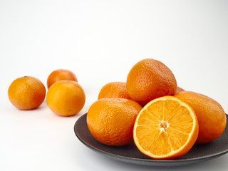 Tangerines or orange Mandarin fruit and peeled slices. A bunch of oranges and half.
