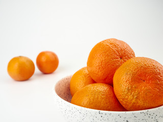 Tangerines or orange Mandarin fruit and peeled slices. A bunch of oranges and half.
