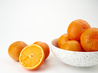Tangerines or orange Mandarin fruit and peeled slices. A bunch of oranges and half.