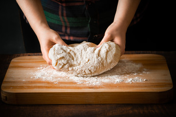 The chef prepares pizza dough