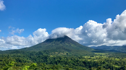 Fototapeta premium Arenal Volcano With Clouds Blue Sky Sunset