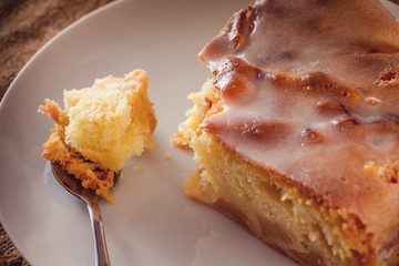 Apple pie on a plate on a linen background