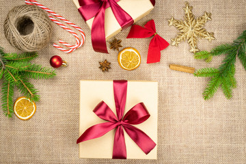 Xmas Gifts. Gold 2020 New Year decoration isolated on linen texture background. Banner mock up for display of product or design content