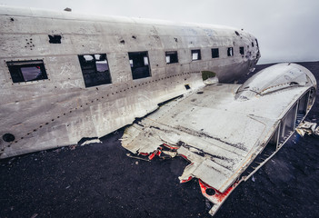Side view of Douglas Super DC plane wreck on a Solheimasandur black beach, Iceland