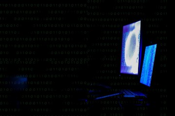 Internet crime concept. Hacker working on a code on dark digital background with digital interface around.