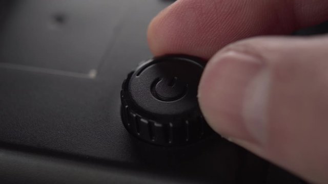 A black start button and power adjustment device with a plastic case twist your finger. Smooth power increase