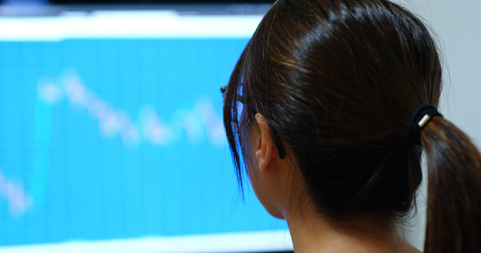Woman study on the stock market data in office