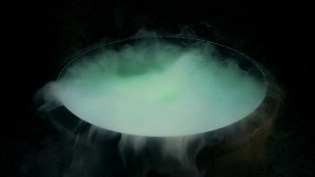 Swirling Smoke And Bubbling Green Liquid In Cauldron