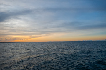 Ocean against a beautiful background of sunset sky