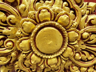 Traditional Thai style stucco on the wall of church in temple, Thailand.