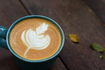 hot latte coffee drink put on wooden table in the morning day