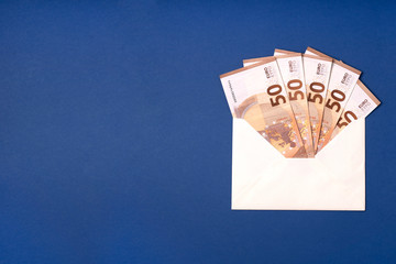 Euro banknote In the envelope. Euro bills on blue background. Money savings, gift, cash delivery...