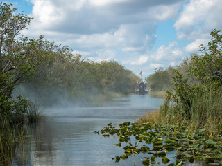 Air boat exhaust and wake with another air boat in the channel at Everglades National Park, Florida.