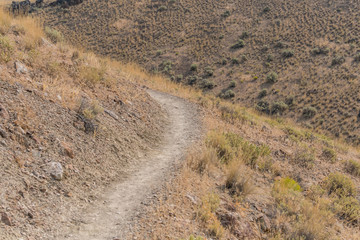 Dry Trail Bends Around Desert Hill