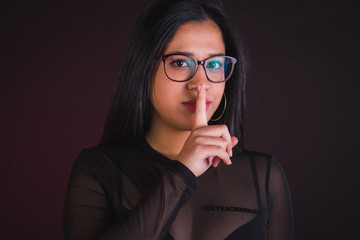 Young girl model posing in black background studio with black transparency t-shirt