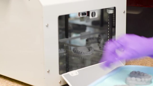 Taking Out Teeth Molds from Machine
