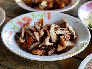 Pork tenderloin marinated in sauce and grilled.