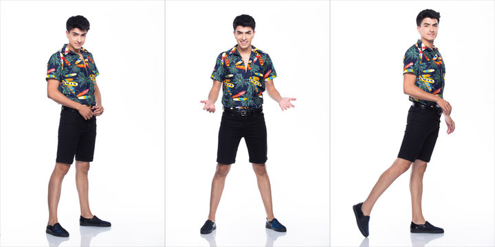 Young Caucasian Man in Summer tropical printed Polo Shirt black short stand and walk in smile happy action with using smart mobile phone, white background isolated, Full Length collage group concept © Jade