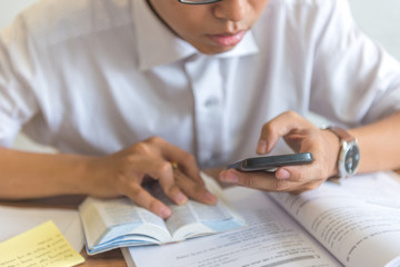Man using smartphone and studying English lesson