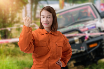 Female Auto mechanic and hand holding wrench
