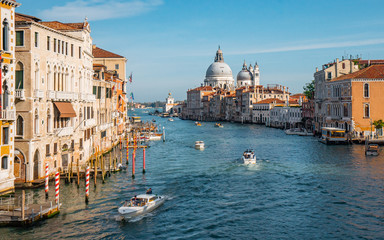 Fototapeta na wymiar Nice view of grand canal and the classical building in venetian styles from Accademia bridge during evening in Venice , Italy