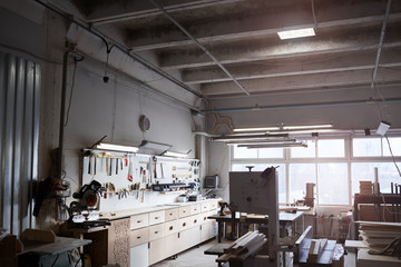 Image of workshop with work tools and lathe for the manufacture of furniture from wooden planks