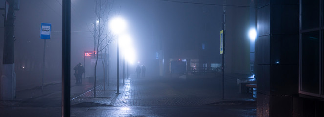 the night city with the foggy weather conditions, mystery outdoors, fear while walking alone