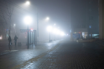 the night city with the foggy weather conditions, mystery outdoors, fear while walking alone