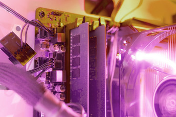 macro shot of the computer ram memry slots installed into the motherboard with colorful background