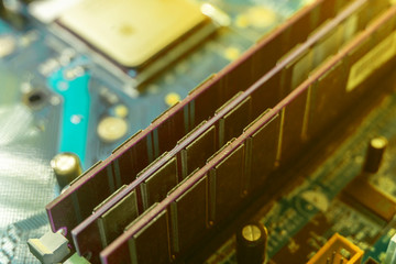 macro shot of the computer ram memry slots installed into the motherboard with colorful background