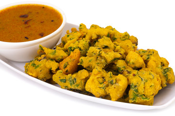 Indian Favourite Street Fried Food Pakora Also Know as Pakoda, Bhajiya, Rava Bhaji, Kanda Bhaji, Pyaz Pakoda, Fried Chillies, Fried Onion Pakora Served with Chutney