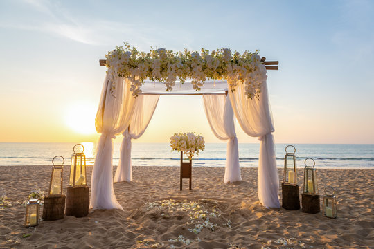 beach ceremony setup with Golden light sunset