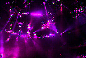 Purple light on a rock concert stage as background