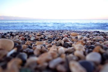 the sea coast in the afternoon with waves and splashes, the sea coast with stones.