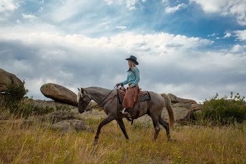 Cow Girl On Rocky Mountain Horse