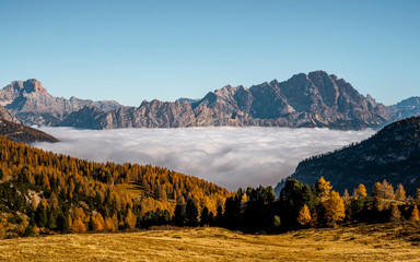 Nice view with fog from nature landscape in Dolomites . The mountain range in northern part of Italian Alps during autumn , Dolomites ,  South Tyrol and Trentino in Italy