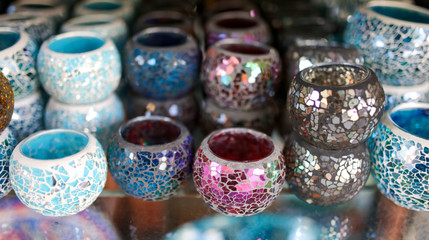 Multi-colored glasses on the counter in the market
