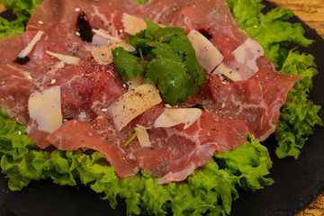 Beef carpaccio with parmesan cheese