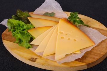 Sliced yellow Swiss cheese