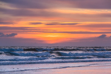 Crashing waves at the back at sunrise