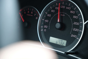 closeup side view of speedometer 120 kph speed
