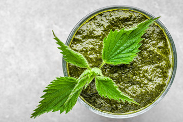 Detox juice or green smoothie, healthy drink with leaves of nettle
