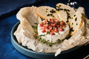 Baked Camembert with ham and baguette.