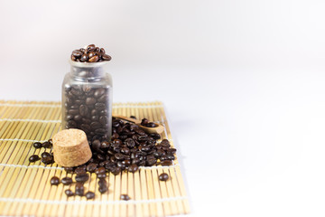 Roasted coffee beans with bread and sugar, Black coffee. Cafe shop table. Coffee beans, paper cups, brown sugar, Take a bread with hot drink.