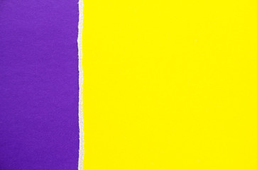 Purple and yellow torn cardboard paper texture background. Can be used for text.